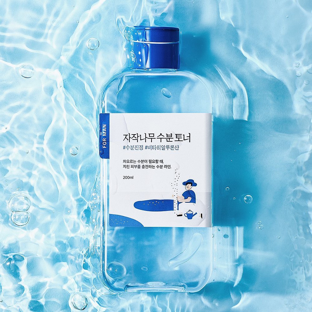 ROUND LAB For Men Birch Moisture Toner 200ml - Gentleman Korea product image showing clear blue bottle on water background