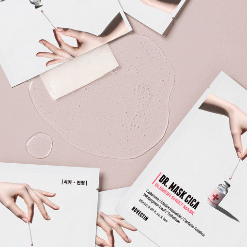ROVECTIN Doctor Cica Blemish Mask packets with hands applying serum on a beige background
