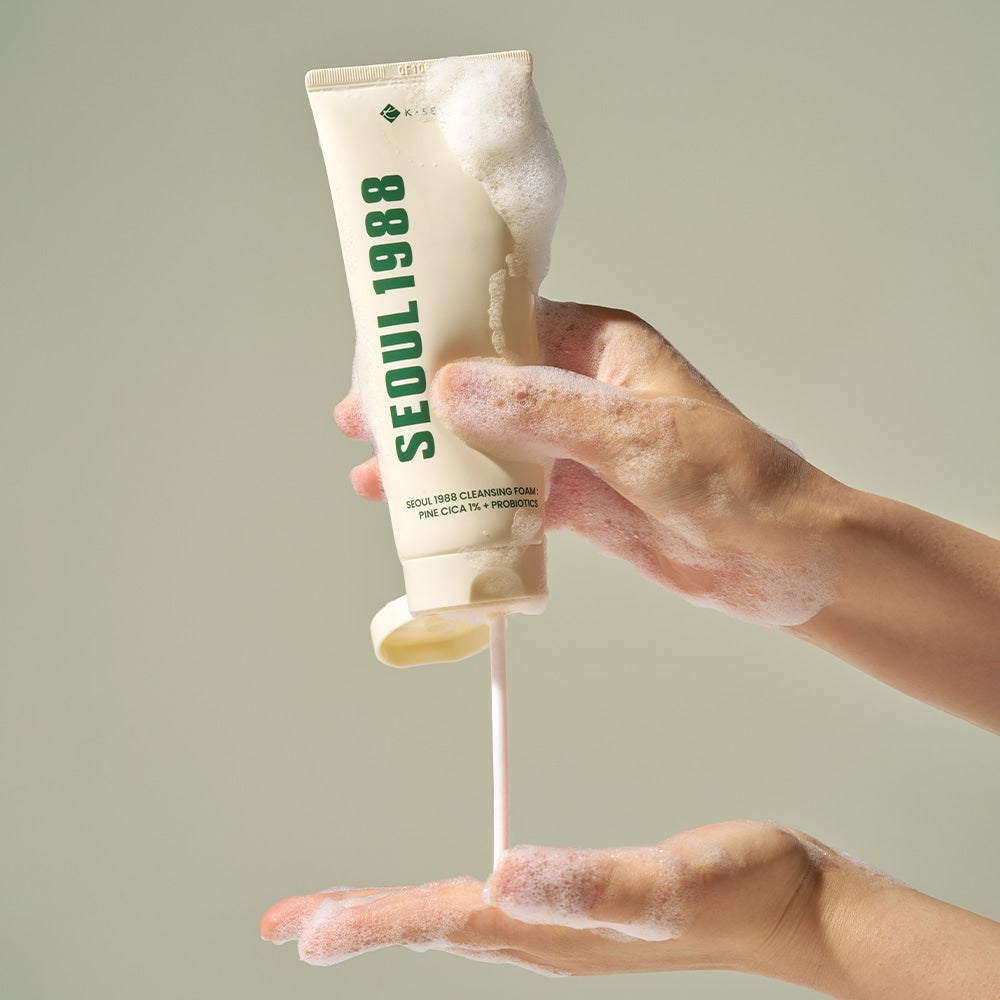 Person using SEOUL 1988 Pine Cica Cleansing Foam with rich lather for gentle skin cleansing.