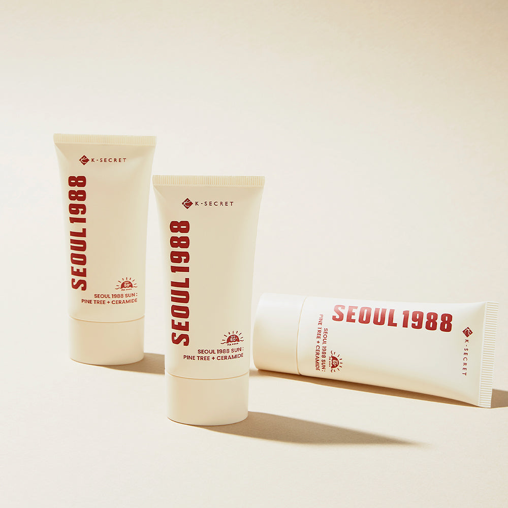 SEOUL 1988 Pine Sunscreen tubes on a beige background