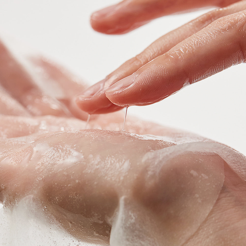 Applying SHAISHAISHAI [10+10]Aloe PDRN Cooling Gel Pads Mask 10 Sheets on skin for soothing effect.