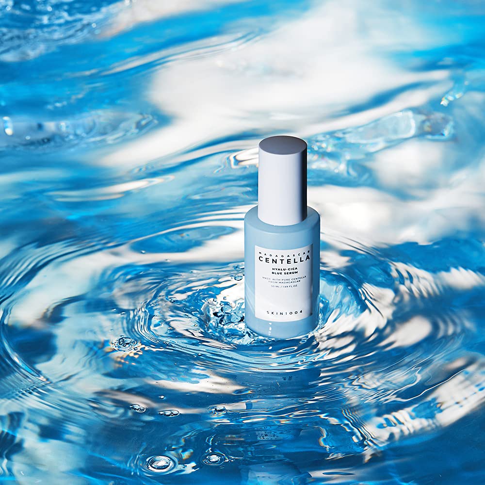 SKIN1004 Madagascar Centella Hyalu-Cica Blue Serum 50ml bottle on blue water background