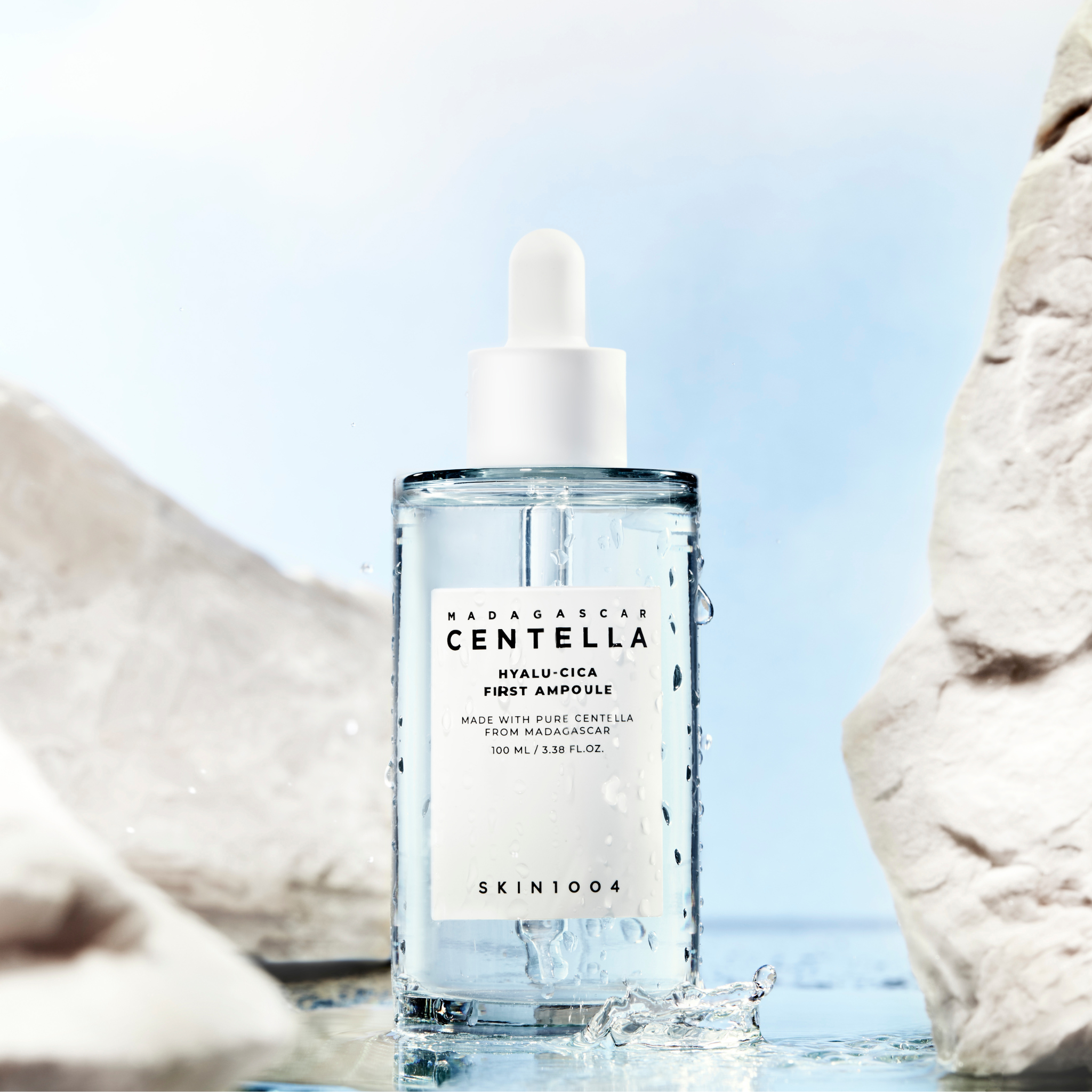 SKIN1004 Madagascar Centella Hyalu-Cica First Ampoule 100ml bottle displayed with water and rocks background