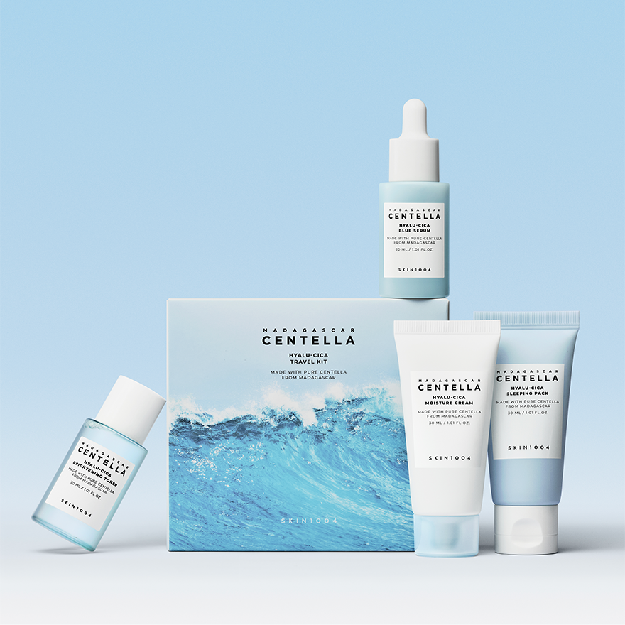 SKIN1004 Madagascar Centella Hyaluronic Acid Travel Kit with four skincare products on a blue background.