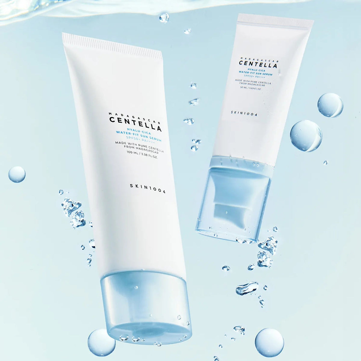 SKIN1004 Madagascar Centella Hyaluronic Acid Water-Fit Sun Serum 100ml with hydrating droplets and light blue background