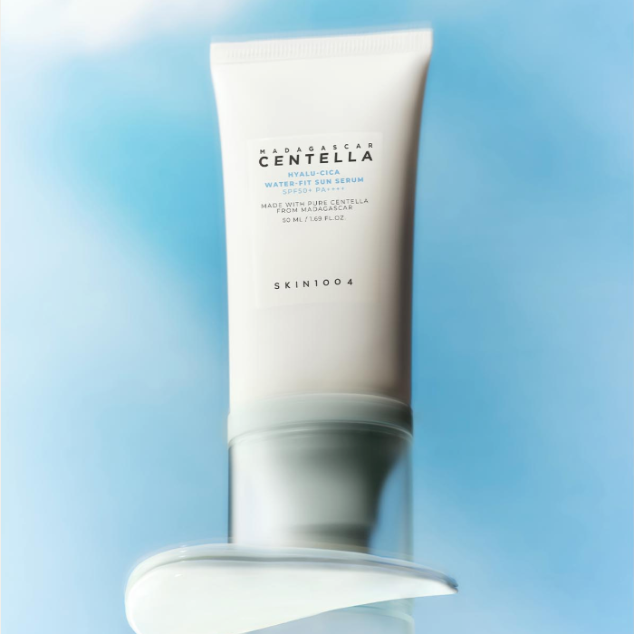 SKIN1004 Madagascar Centella Hyaluronic Acid Water-Fit Sun Serum 50ml with lightweight texture on a sky background