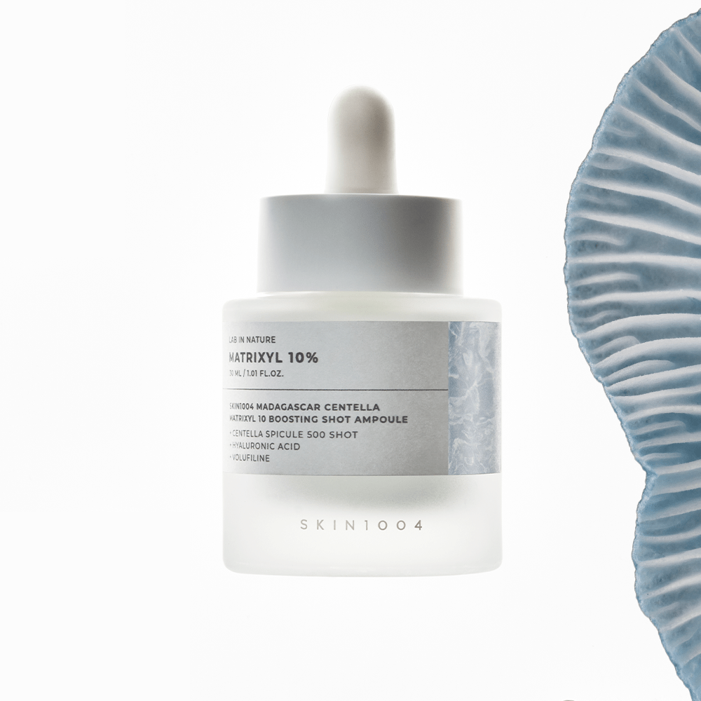 SKIN1004 Madagascar Centella Matrixyl 10 Boosting Shot Ampoule 30ml bottle with blue abstract design.