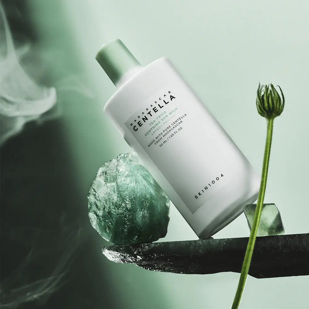 SKIN1004 Madagascar Centella Tea-trica Soothing Sun Milk 50ml product on display with natural elements