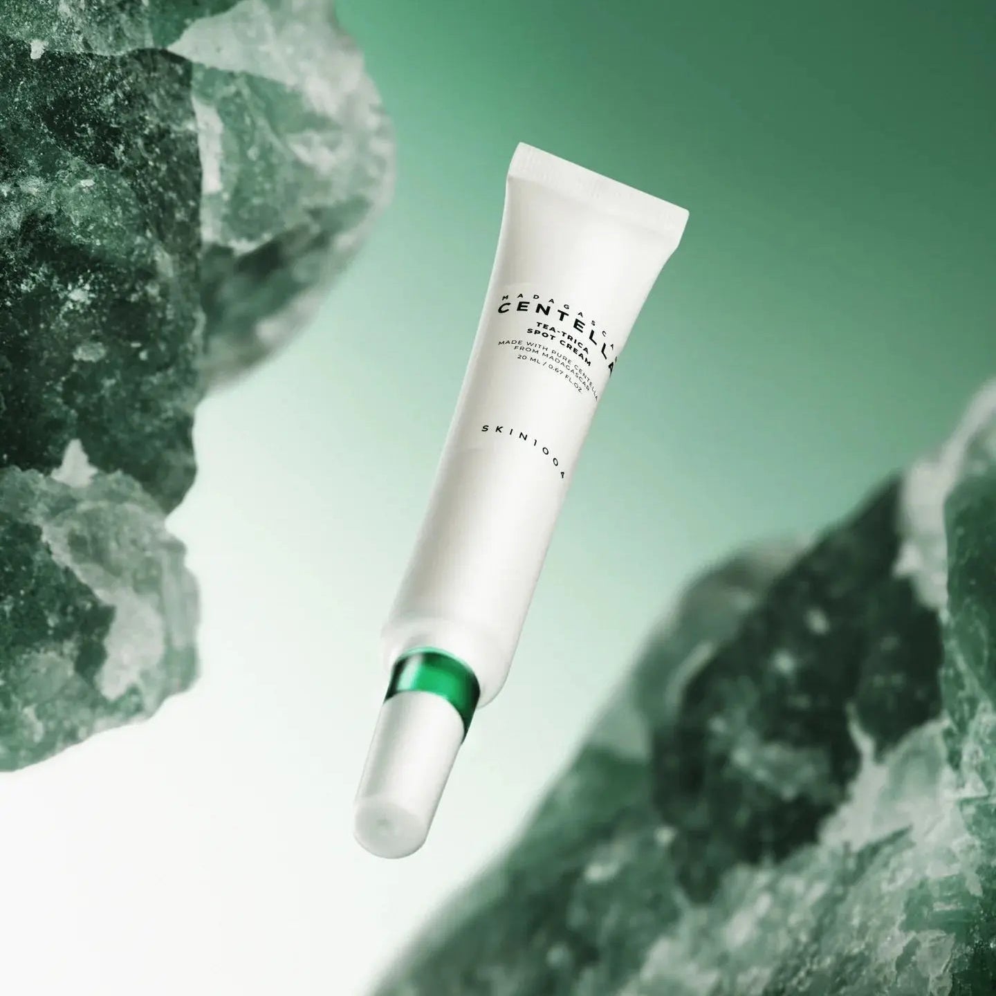 SKIN1004 Madagascar Centella Tea-trica Spot Cream 20ml tube on a green background with stones