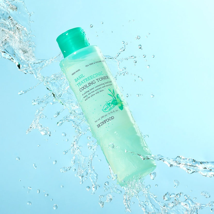 SKINFOOD Basil Tea Tree Cynic Cooling Toner 200ml bottle with water splash, refreshing skincare product for oily and acne-prone skin.