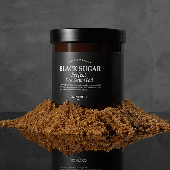 SKINFOOD Black Sugar Perfect First Serum Pad 60p 250g displayed with brown sugar.