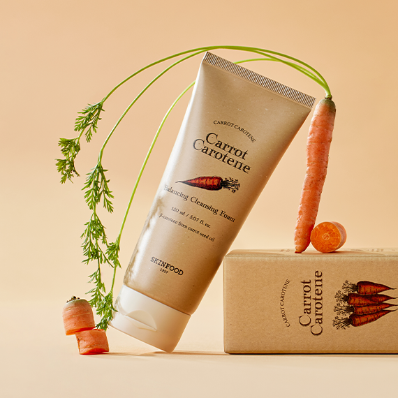 SKINFOOD Carrot Carotene Balancing Cleansing Foam 150ml with carrot imagery in an aesthetic setting