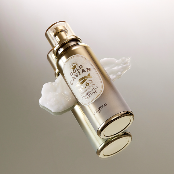 SKINFOOD Gold Caviar Collagen Plus Serum 40ml bottle with luxurious creamy texture background