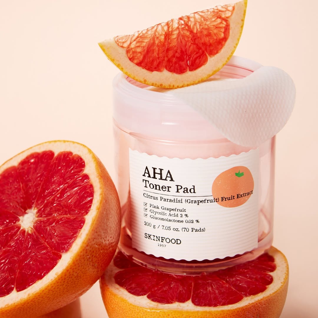 SKINFOOD Pink Grapefruit AHA Toner Pad 70 sheets displayed with fresh grapefruit slices