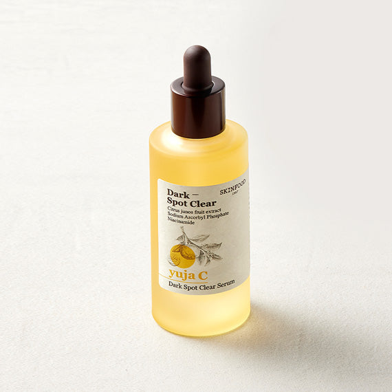 SKINFOOD Yuja C Dark Spot Clear Serum 50ml bottle on a light background