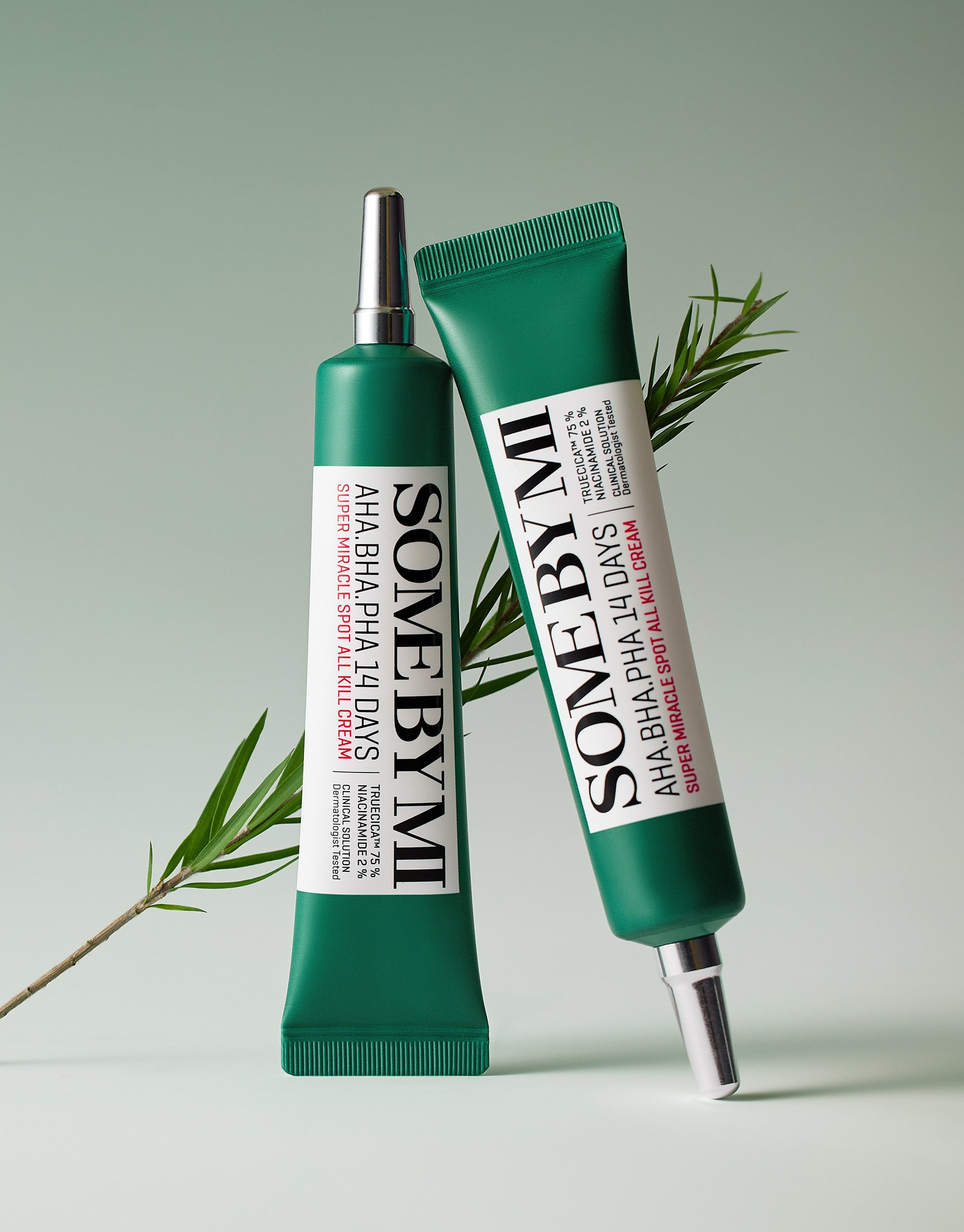 SOME BY MI AHA.BHA.PHA Miracle Spot All Kill Cream 30ml duo tubes with green packaging and plant element in the background.