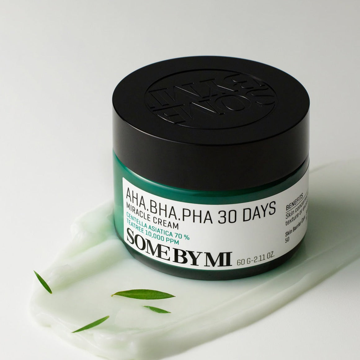 SOME BY MI AHA.BHA.PHA miracle cream 60g jar on a white background with green leaves