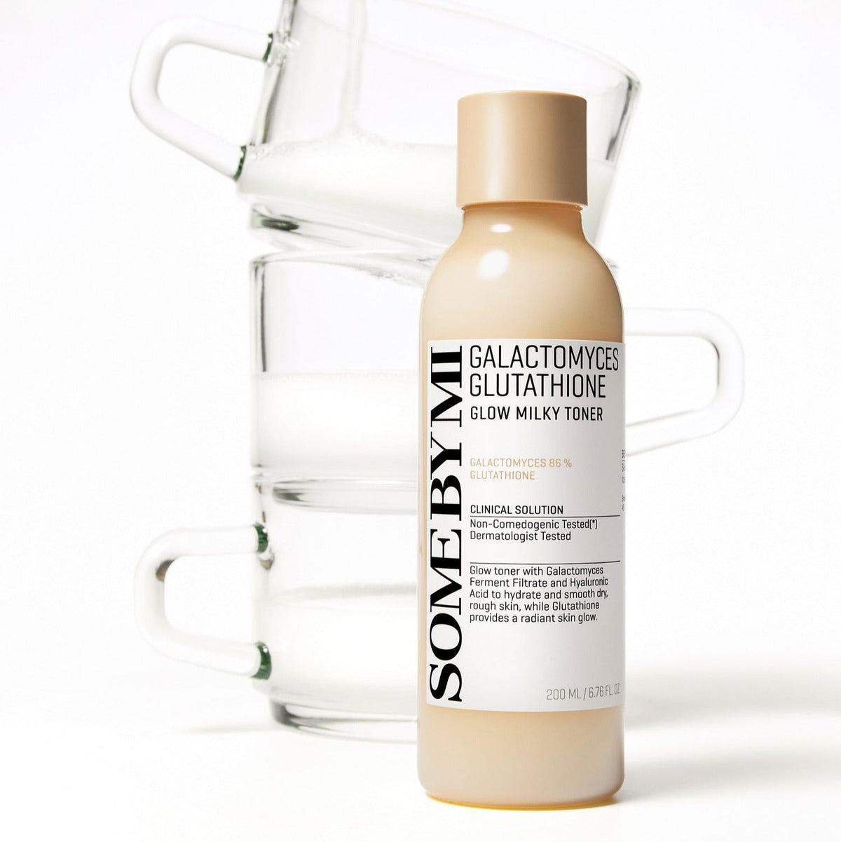 SOME BY MI Galactomyces Glutatione Glow Milky Toner 200ml bottle in front of stacked glass containers