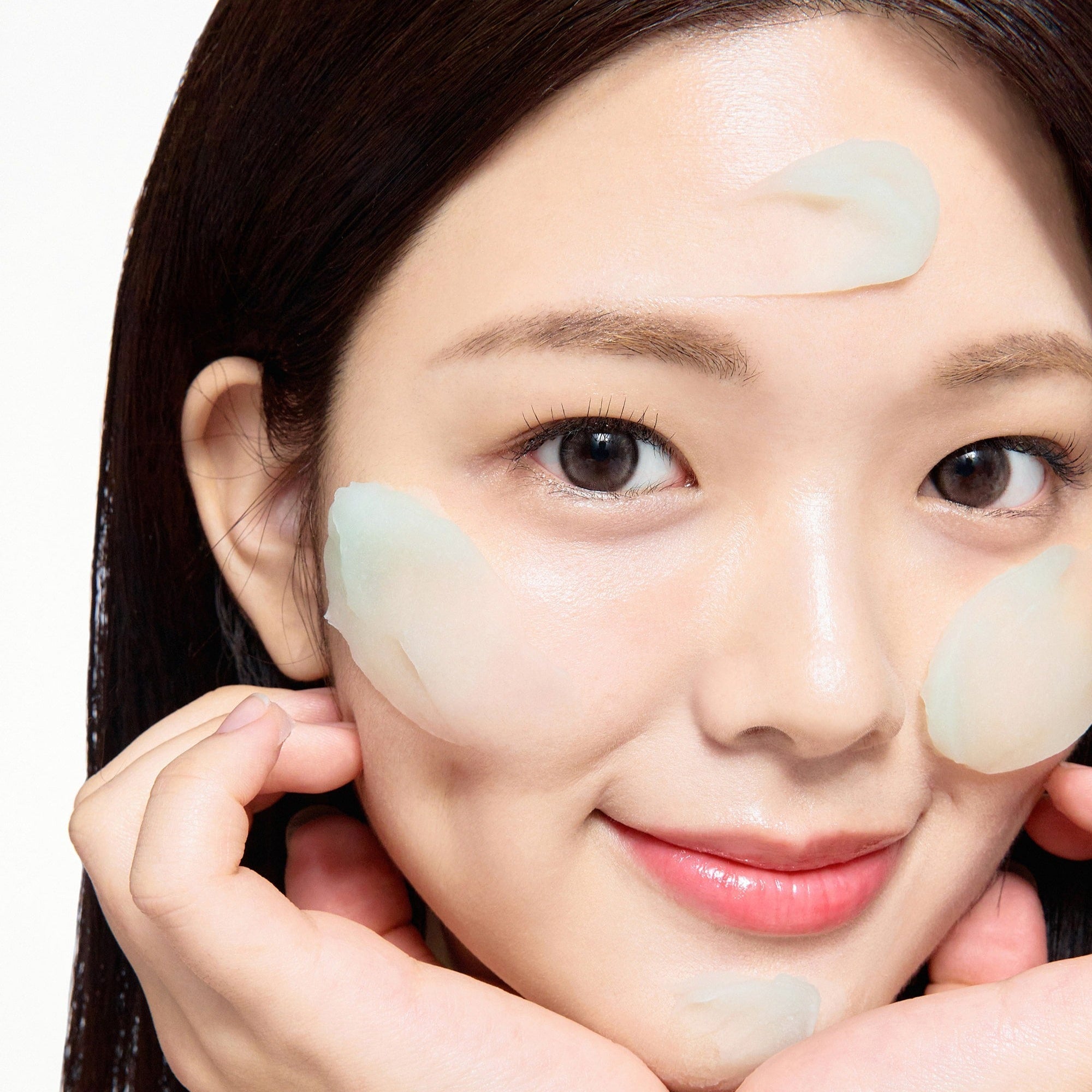 Woman applying SOME BY MI PDRN Spirulina Soothing Sherbet Mask 1g x 10ea for skincare