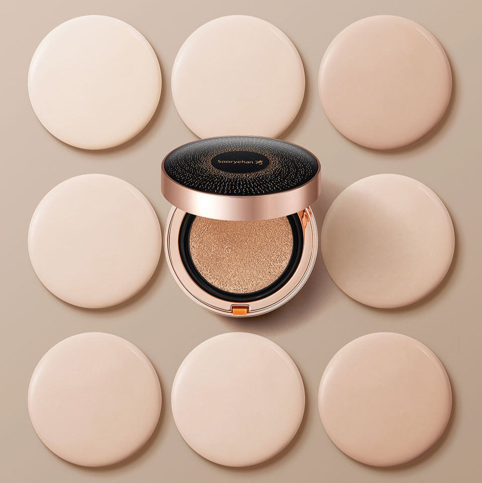 SOORYEHAN Beautiful Black Ginseng Cushion Project 15g surrounded by beige makeup pads, showcasing the elegant packaging and cushion texture.