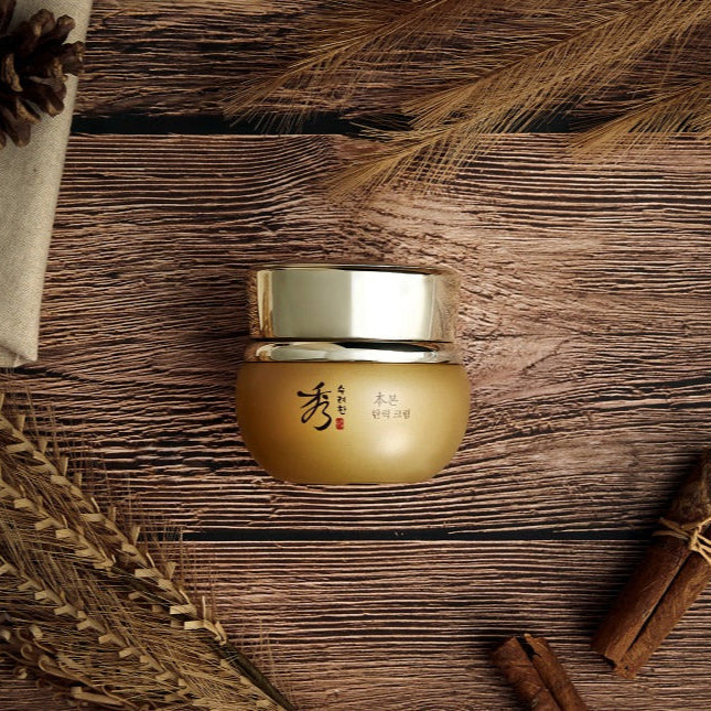 SOORYEHAN Bon Elasticity Cream 75ml jar on wooden surface with rustic elements.