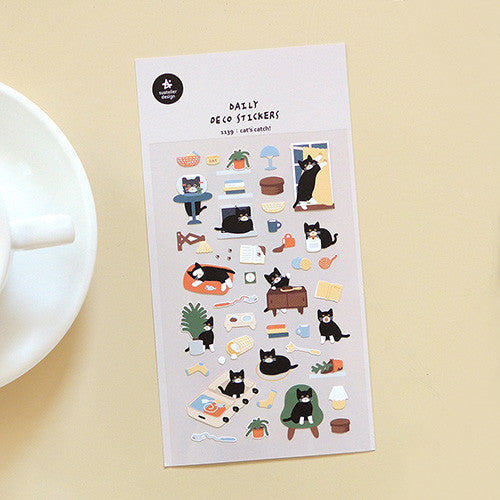 SUATELIER Cat's Catch! Stickers featuring playful cat illustrations, perfect for decorating planners and journals, displayed on a wooden table.