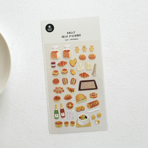 SUATELIER Old Bakery Stickers featuring various bread and pastry designs on a sheet for crafting and decoration.