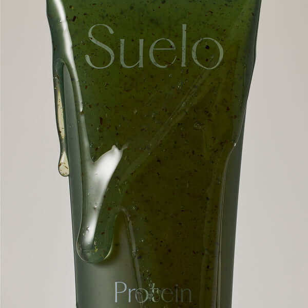 SUELO Protein Ampoule Gel Cleansing Foam in green ampoule package with rich texture
