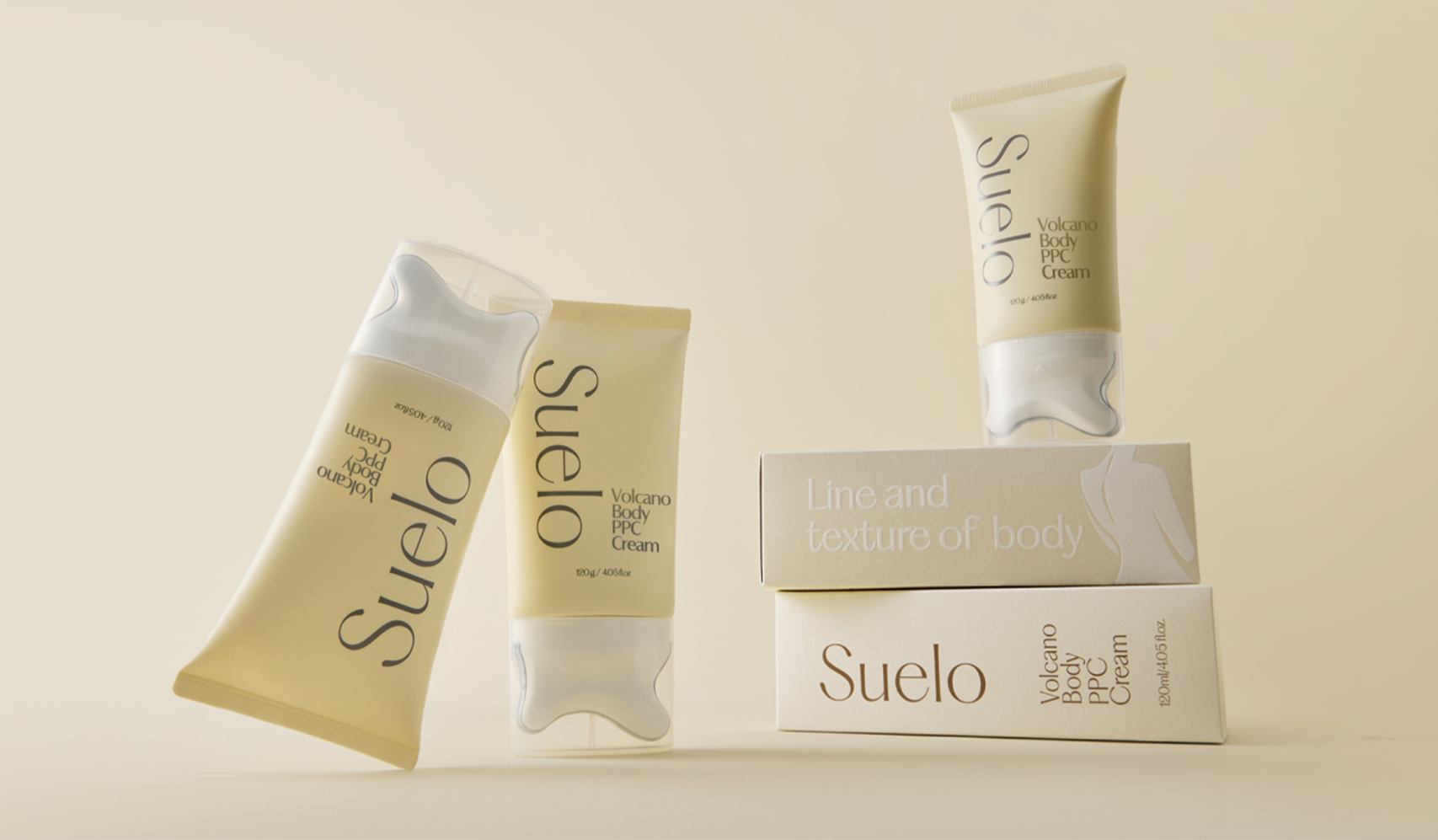 Suelo Volcano Body Cream tubes and boxes displayed on a beige background, emphasizing luxury skincare packaging.