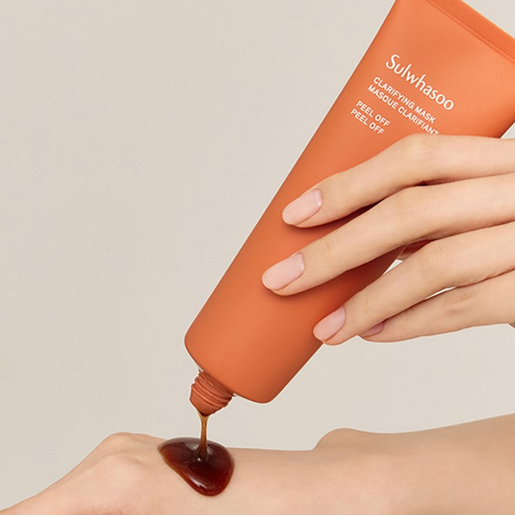 Applying SULWHASOO Clarifying Mask 120ml on skin for a refreshing skincare routine.