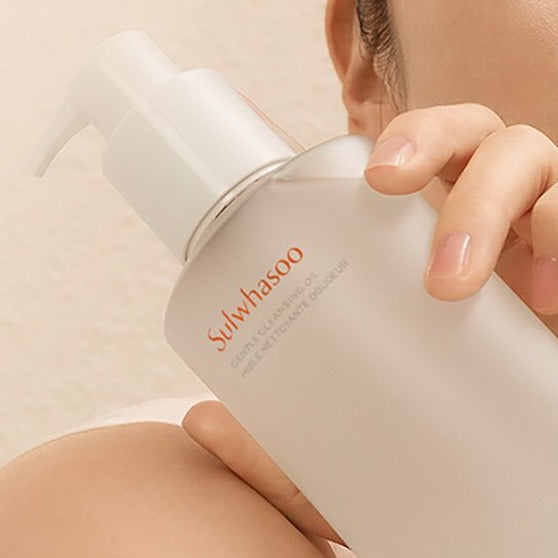 SULWHASOO Gentle Cleansing Oil 200ml bottle held by woman, part of skincare routine stages including makeup removal and cleansing.