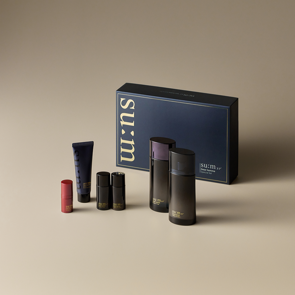 SU:M37 Dear Homme Basic 2-piece set displayed with navy gift box and skincare bottles, Gentleman Korea premium Korean men’s grooming set