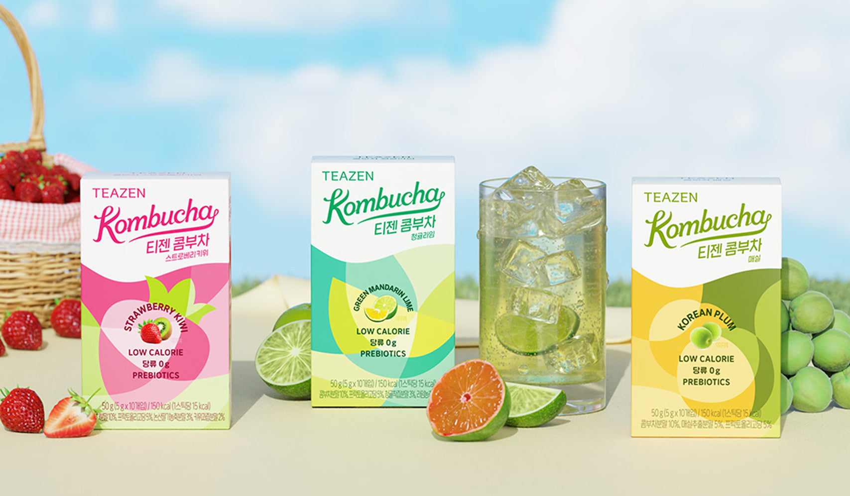 Teazen kombucha products with flavors including strawberry and cinnamon, lime dry lemon, and apple jelly, presented with fresh ingredients.