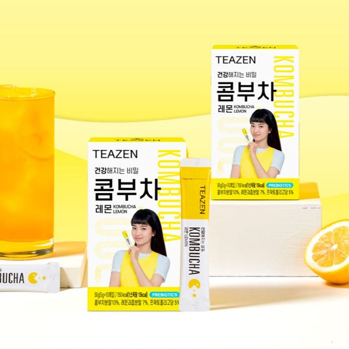 TEAZEN Kombucha Lemon 10 Sticks packaging with lemon drink and sliced lemon in the background.