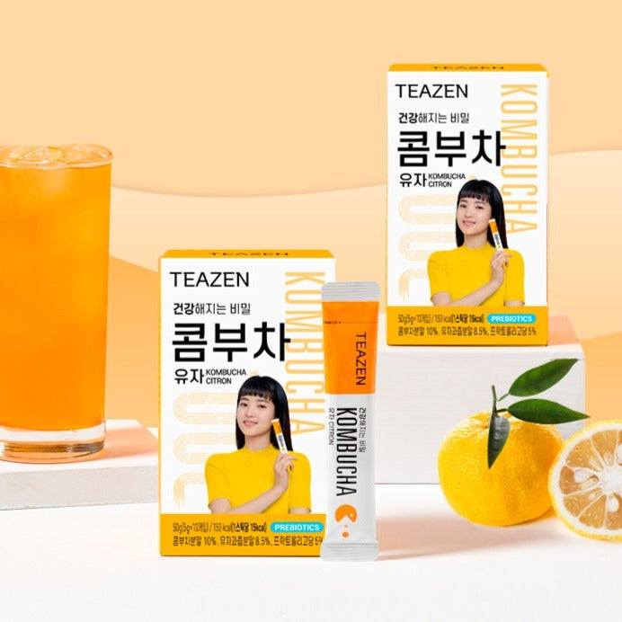 Image of TEAZEN Kombucha Yuja Citron 10 Sticks with packaging and a refreshing drink.