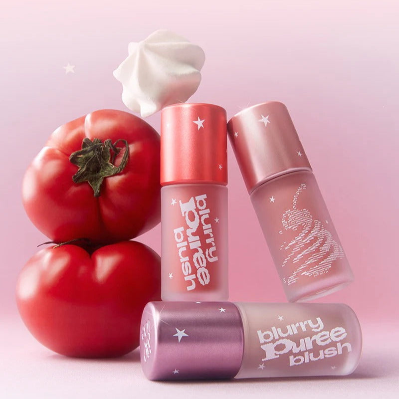 TIP TOE Blurry Puree Blusher with vibrant colors and tomato-inspired design against a pink background.