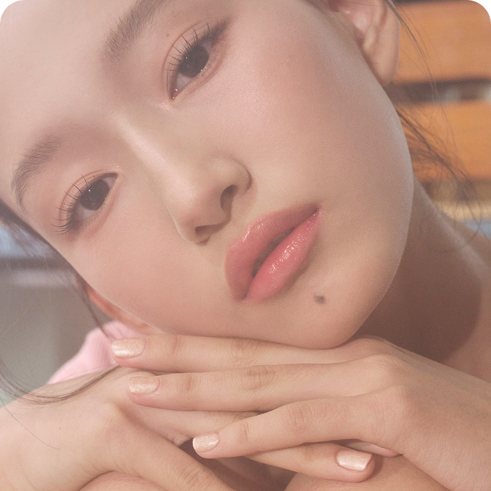 Model wearing TIP TOE Matte Glitter Nail Polish on nails.