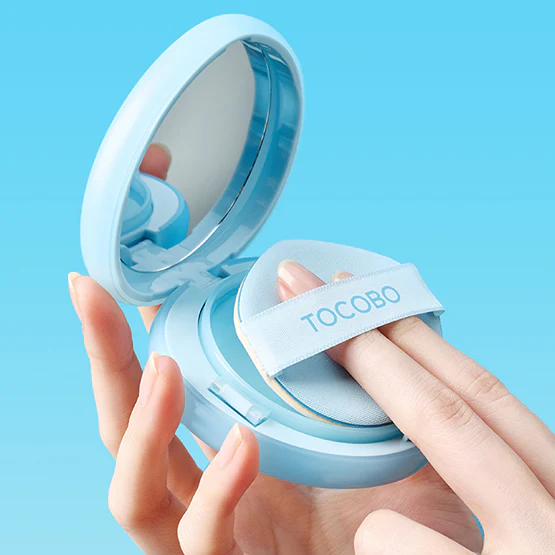TOCOBO Blur Finish Sun Cushion in use, demonstrating the compact design and sun-protective makeup application.