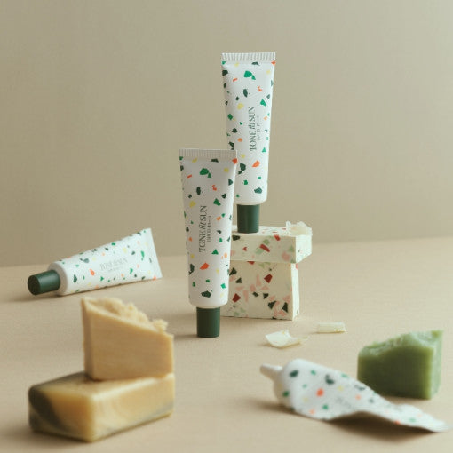 TONE FIT SUN Vegan Tone Up Sun Cream 50ml SPF50+ PA++++ tubes displayed with natural soap bars on a neutral background.