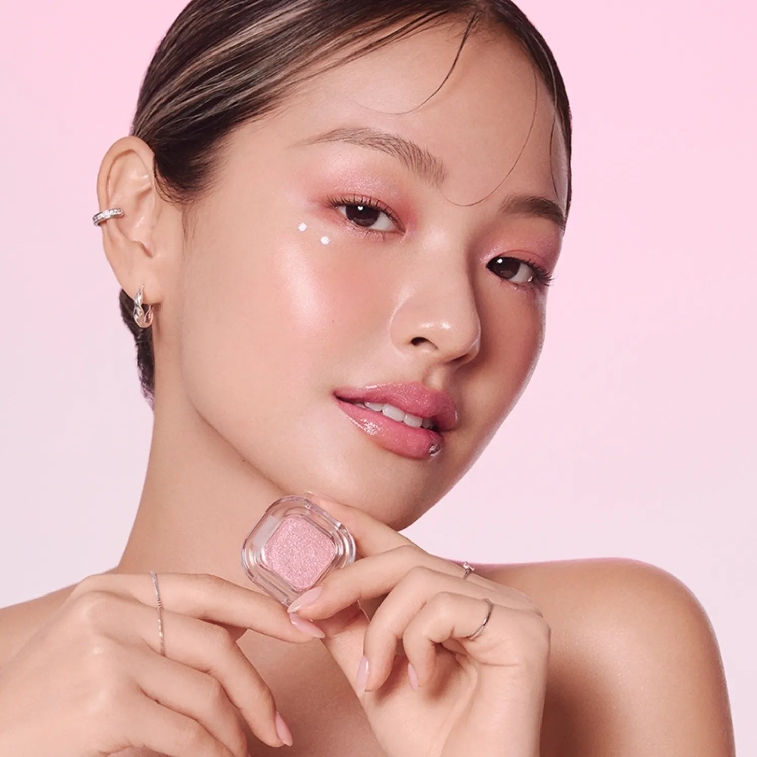Model wearing TONY MOLY Eyetone Single Eyeshadow in pastel pink shade, showcasing vibrant makeup look.