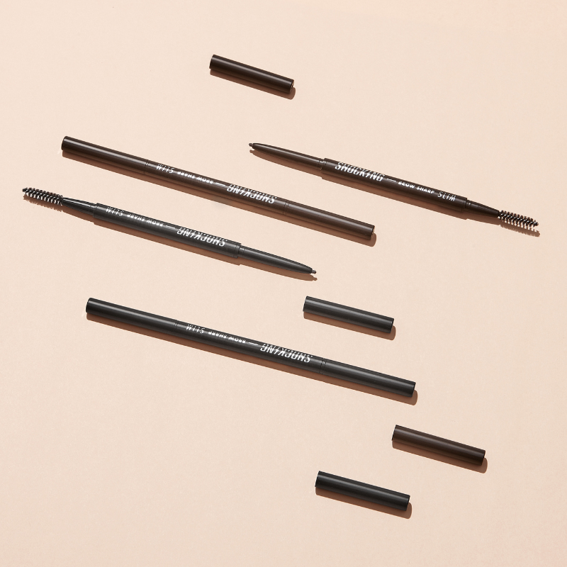 TONY MOLY The Shocking Vegan Brow Sharp Slim eyebrow pencils on a beige background.