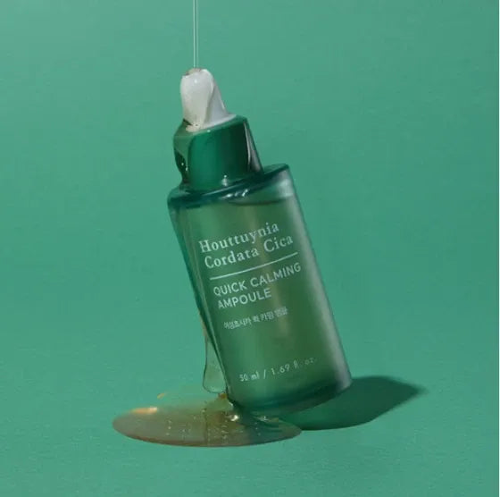 TONYMOLY Quick Calming Ampoule 50ml on green background with liquid spill
