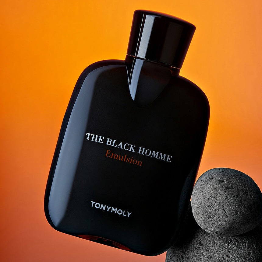 TONYMOLY The Black Homme Emulsion 160ml - Gentleman Korea product shot of black emulsion bottle on orange background for men’s skincare