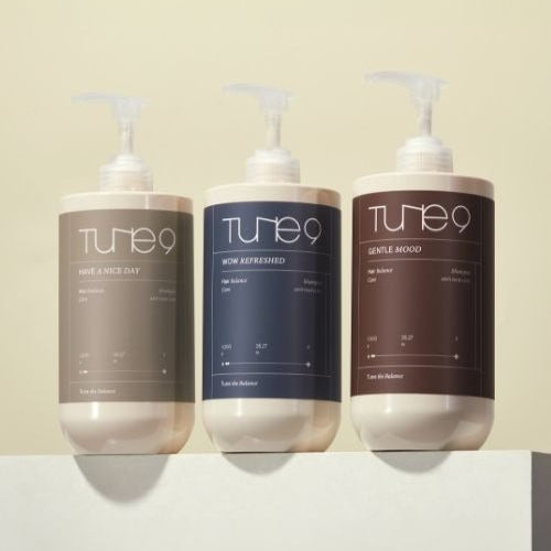 Three bottles of TONYMOLY Tune 9 shampoos, including the Gentle Mood Shampoo 1000g, displayed on a neutral background.