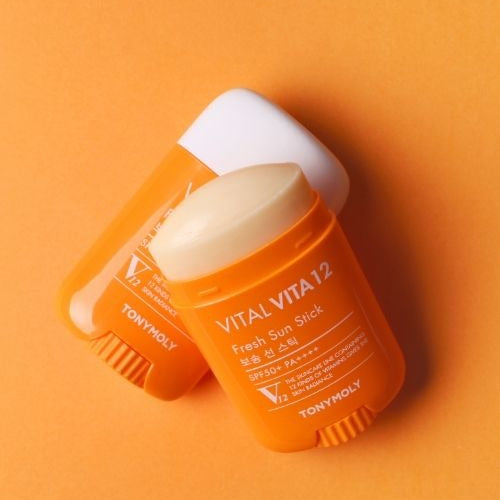TONYMOLY Vital Vita12 Tone Up Sun Stick 22g in orange packaging on orange background