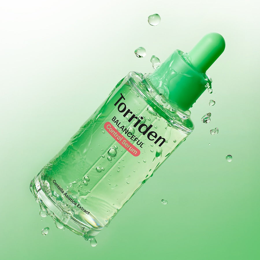 TORRIDEN Balanced Cica Control Serum 50ml product image with green background and droplets showcasing texture.