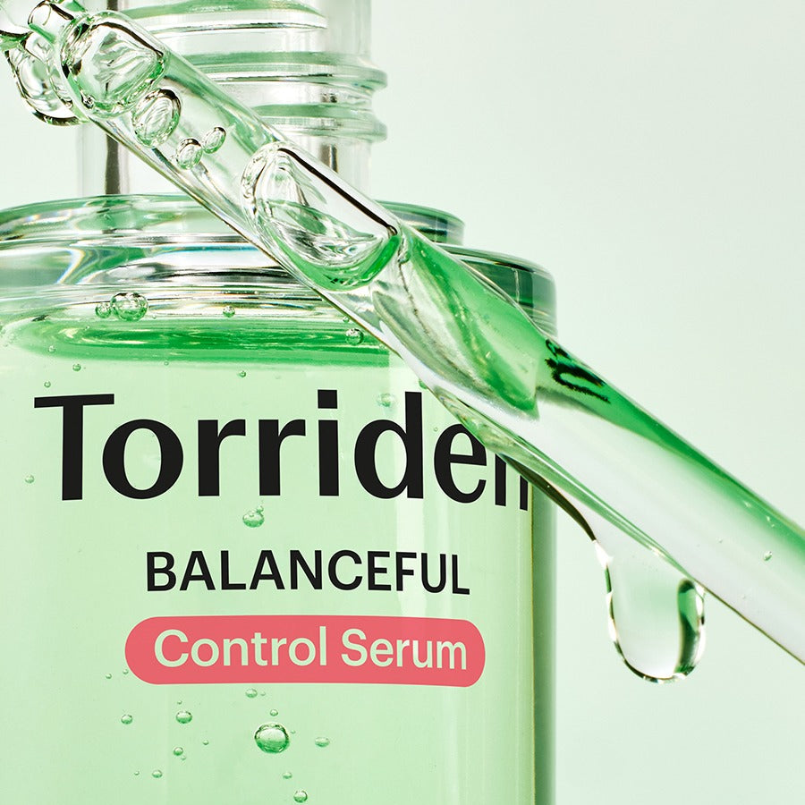 Close-up of TORRIDEN Balanced Cica Control Serum 50ml with dropper and green liquid texture.