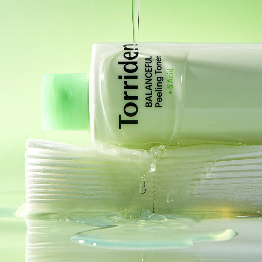 TORRIDEN Balanceful Peeling Toner 250ml bottle with liquid pouring, highlighting the product's hydrating and exfoliating properties.