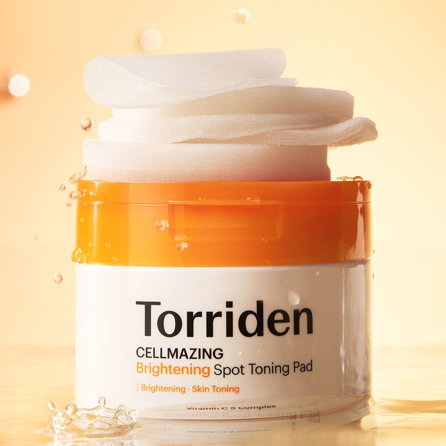 TORRIDEN Cellmizing Vita C brightening Trace Toning Pads 70 sheets, skincare product in orange and white container with stacked pads.