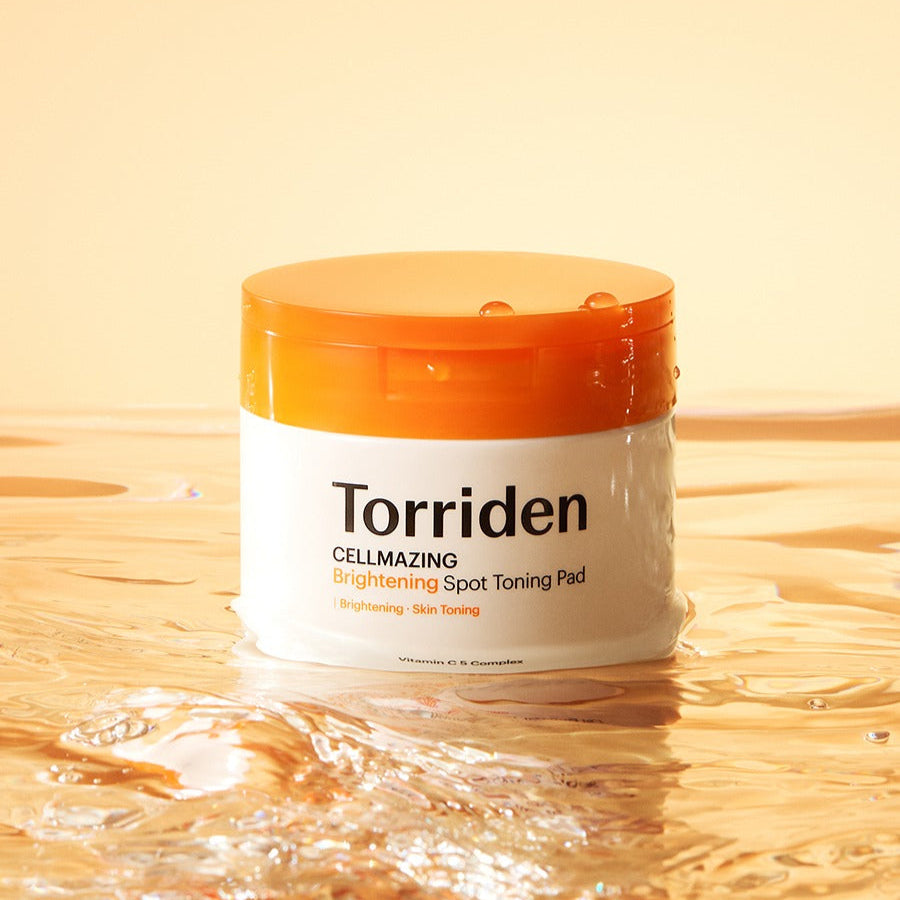 TORRIDEN Cellmizing Vita C brightening Trace Toning Pads 70 sheets in a water-themed setting.